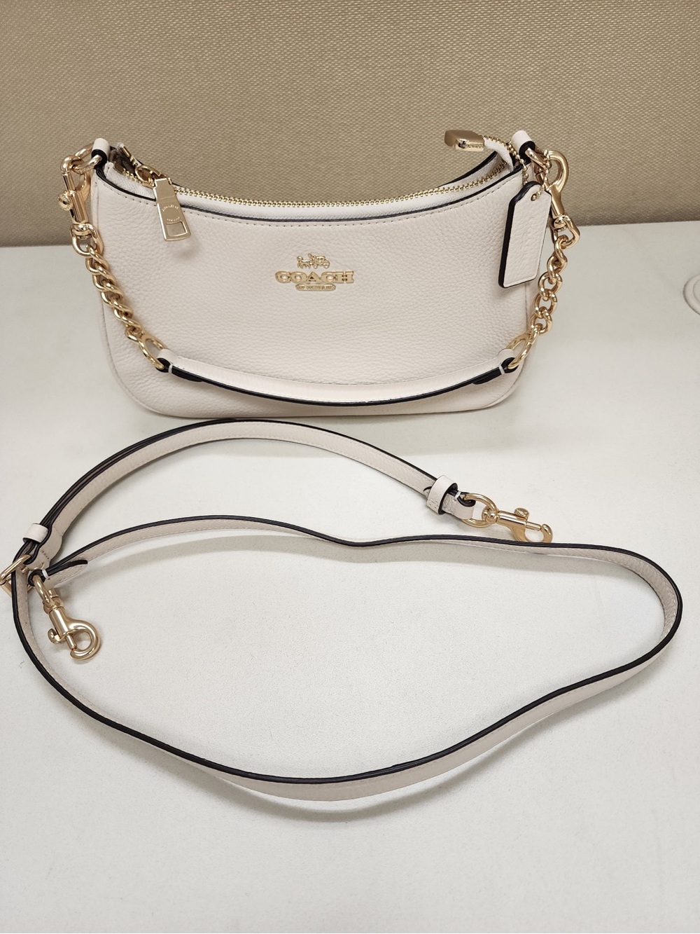 Coach Pebble Leather Mini Bag in Chalk with Gold Chain